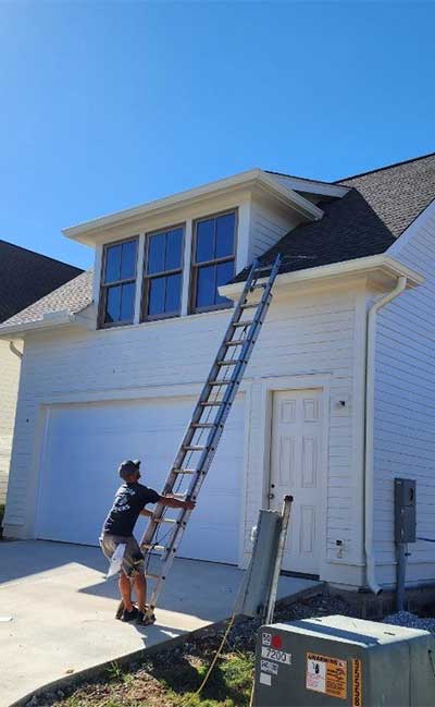 Technician Installing Gutter