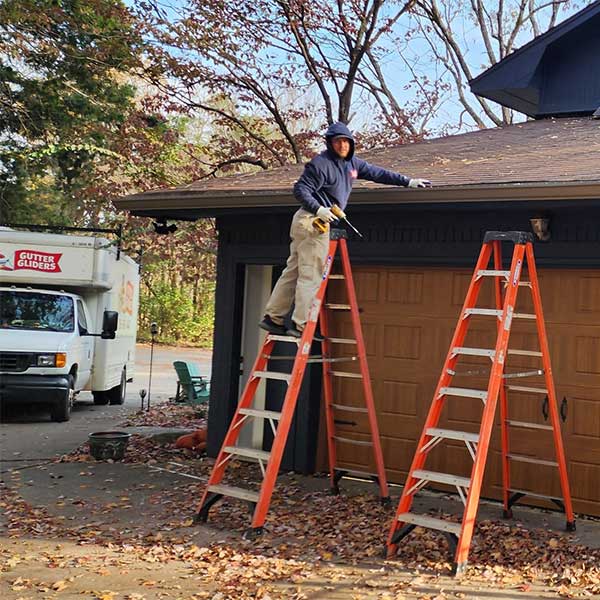 Technician Working on Gutter Repair Technician Working on Gutter Repair