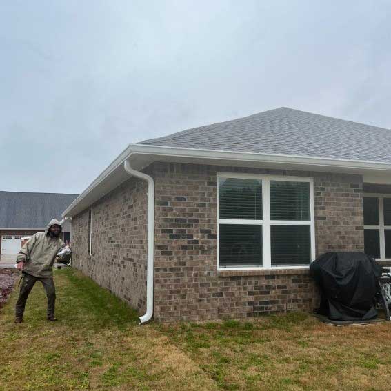 Technician-next-to-House