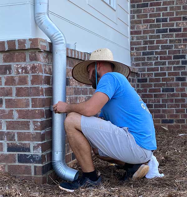 Technician Repairing Gutter Technician Repairing Gutter